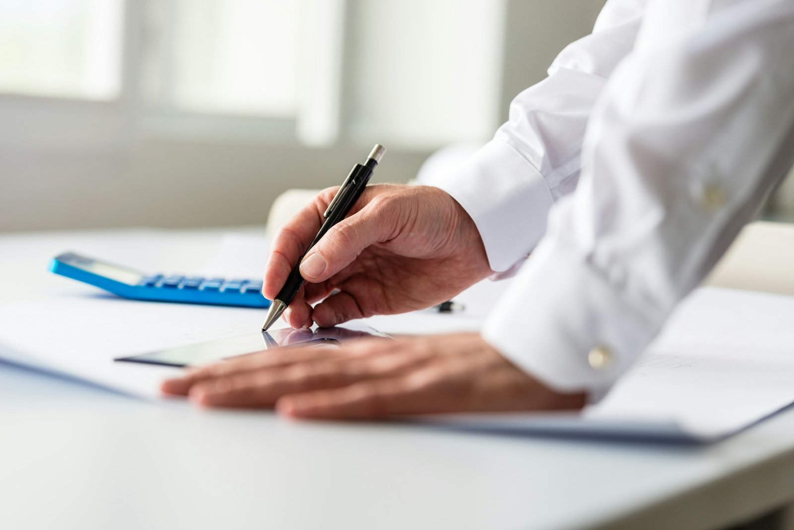 Closeup of an architect working on a project